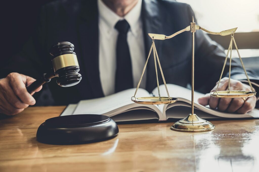 Male lawyer or judge working with contract papers